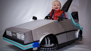 Illustration for article titled This Awesome Baby's Marty McFly Costume and DeLorean Push Car Is Absolutely Adorable